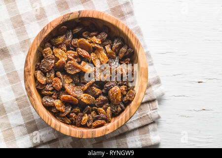 Dried raisins in bowl. Top view. Stock Photo
