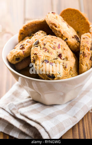 Sweet cookies with raisins in bowl. Stock Photo