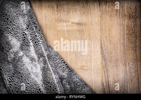 Distressed overlay texture of crocodile or snake skin leather on wooden background with copy space Stock Photo