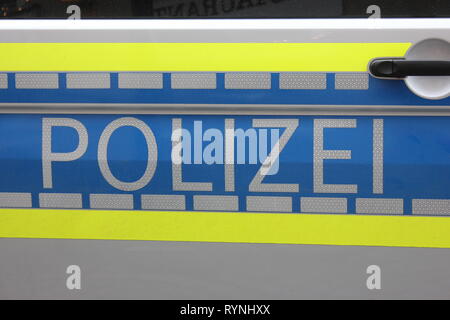 Side view german police car on door, labeled with reflecting letters. Stock Photo