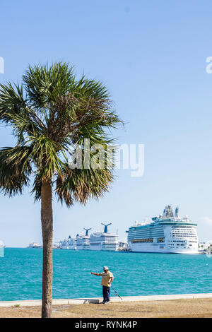 Miami Florida,Bicentennial Park,Biscayne Bay,Government Cut,Port of Miami,cruise ship,ships,palm tree,man men male,fishing,fisherman,angler,recreation