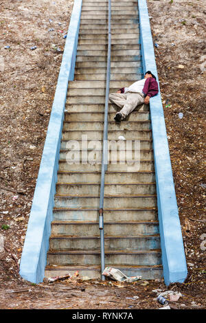 Miami Florida,Black man men male,homeless,vagrant,stairway,park,trash,sleeping,drunk,drunkenness,collapsed,FL090202098 Stock Photo