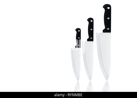 Set of new sharp chef knives with black handle isolated on white background. Stainless steel knife for home cook or for chef in restaurant kitchen. Bu Stock Photo