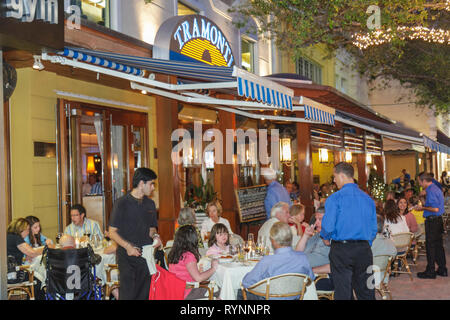 Parents with children eating at beach Stock Photo - Alamy