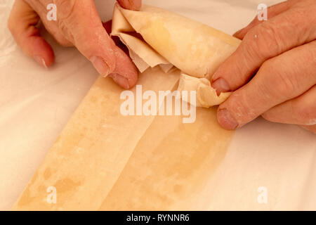 Puff pastry cheese bites making close up Stock Photo