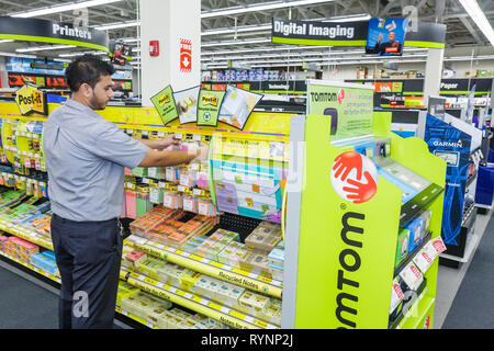 Miami Florida,Staples,office supply products store,chain,display sale Post it,recycled notes,Hispanic man men male,stock clerk,working,work,employee w Stock Photo