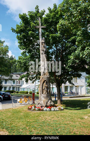 JUODKRANTE, LITHUANIA - AUGUST 06, 2018: Traditional wooden sculpture. Juodkrante is a resort town at Curonian Spit  in Lithuania Stock Photo