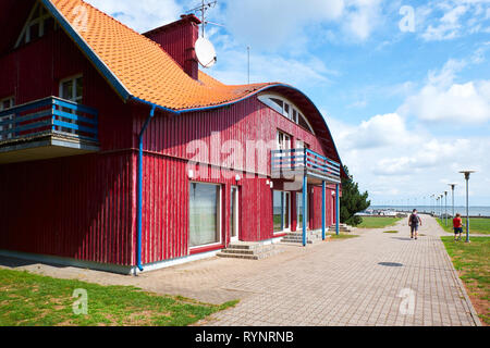 JUODKRANTE, LITHUANIA - AUGUST 06, 2018: Traditional wooden village house. Juodkrante is a resort town at Curonian Spit  in Lithuania Stock Photo