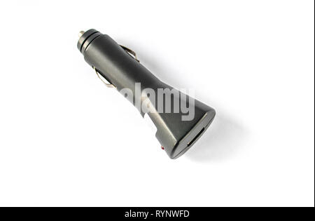 Car charger on a white background. Car cigarette lighter, for player, for e-books, for tablet, for phone, smartphone, universal. Stock Photo