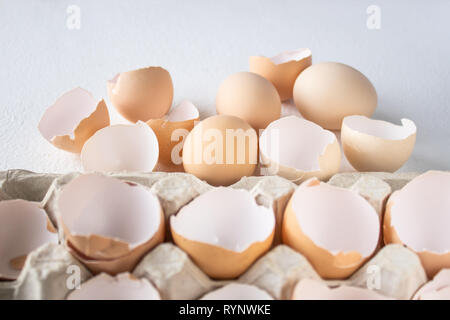 Eggs and shkarlupka eggs in a box on a white background. Stock Photo