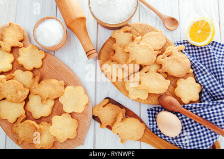 Happy Easter. Baking Easter bunnies. Ingredients with Easter decoration on wooden table Stock Photo