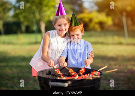 Two happy children having fun in the park Stock Photo