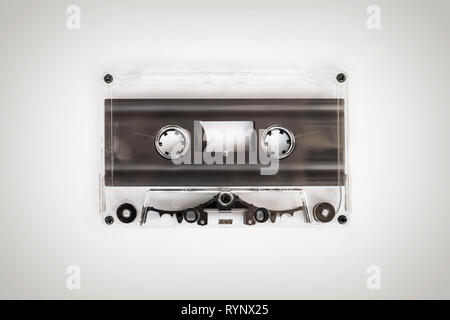 Translucent audio cassette tape on white background Stock Photo