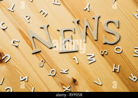 News word on wooden table Stock Photo