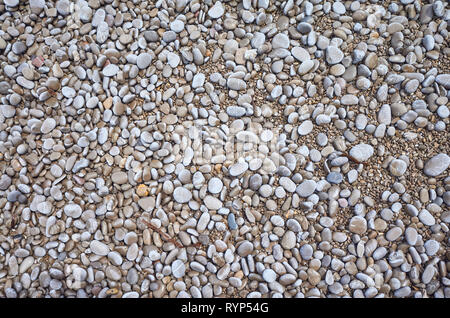 Natural background made of small pebbles on a beach. Stock Photo