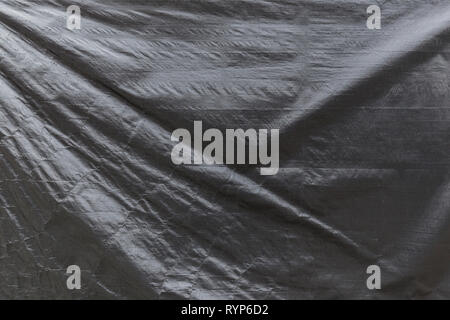 Full frame background of a wrinkled gray tarp texture Stock Photo