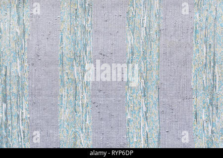 Full frame background of a colorful homemade rag rug viewed from above. Stock Photo