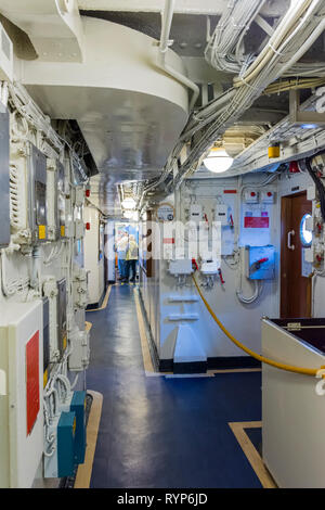 Equipment filled passageway in the lower decks of the Royal Yacht Britannia, Port of Leith, Edinburgh, Scotland, UK Stock Photo