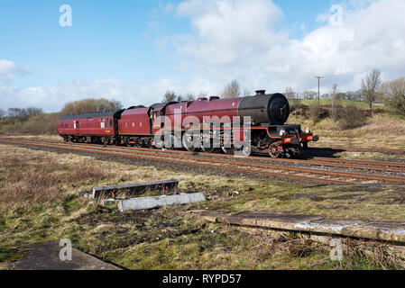 Hellifield, North Yorkshire, UK. 14th Mar 2019. Steam locomotive 6201 'Princess Elizabeth' arrives at Hellifield Station; North Yorkshire; on a mainline test run from it's base at Carnforth; Lancashire. The locomotive was built in 1933 and was named after the then Princess Elizabeth; the current Queen Elizabeth II. The locomotive has recently been restored for mainline railway service. Credit: John Bentley/Alamy Live News Stock Photo