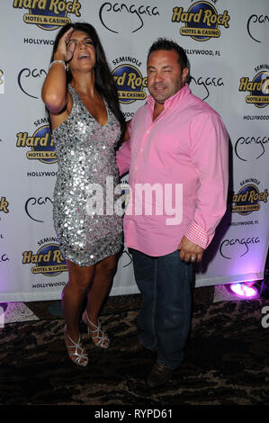 HOLLYWOOD, FL - AUGUST 10: Teresa Giudice and Joe Giudice host Absolutely Fabulous held at The Seminole Hard Rock Hotel and Casino.  'Real Housewives of New Jersey' couple Teresa and Giuseppe 'Joe' Giudice have been indicted on federal charges of bank and bankruptcy fraud, U.S. Attorney Paul J. Fishman announced. The Giudices were charged Monday in a 39-count indictment with conspiracy to commit mail and wire fraud, bank fraud, making false statements on loan applications and bankruptcy fraud, according to the indictment. The fraud was allegedly committed between September 2001 and September 2 Stock Photo