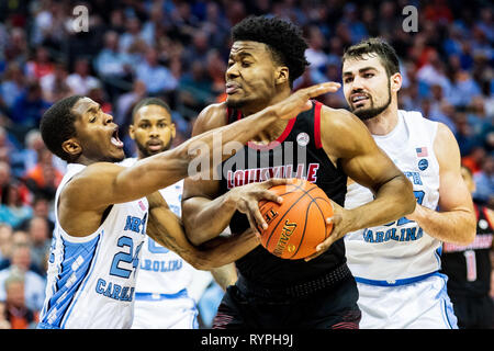 North Carolina Tar Heels guard Kenny Williams (24) and Louisville Cardinals center Steven Enoch (23) during the ACC College Basketball Tournament game between the Louisville Cardinals and the North Carolina Tar Heels at the Spectrum Center on Thursday March 14, 2019 in Charlotte, NC. Jacob Kupferman/CSM Stock Photo