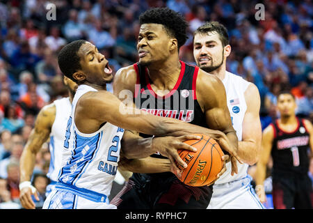 North Carolina Tar Heels guard Kenny Williams (24) and Louisville Cardinals center Steven Enoch (23) during the ACC College Basketball Tournament game between the Louisville Cardinals and the North Carolina Tar Heels at the Spectrum Center on Thursday March 14, 2019 in Charlotte, NC. Jacob Kupferman/CSM Stock Photo