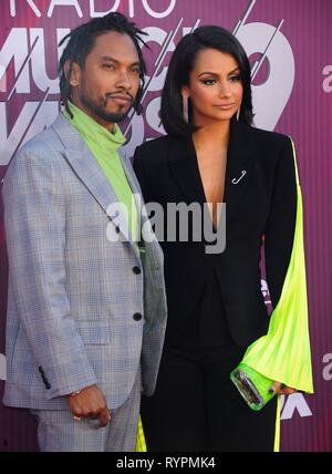 Miguel, Nazanin Mandi at arrivals for 2019 iHeartRadio Music Awards, Microsoft Theater, Los Angeles, CA March 14, 2019. Photo By: Elizabeth Goodenough/Everett Collection Stock Photo