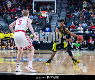 Las Vegas, NV, USA. 14th Mar, 2019. A. Oregon guard Victor Bailey Jr. (10) looks to pass the ball during the NCAA Pac 12 Men's Basketball tournament between the Oregon Ducks and the Utah Utes 66-54 win at T Mobile Arena Las Vegas, NV. Thurman James/CSM/Alamy Live News Stock Photo