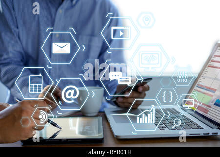 Man using  tablet computer  virtual interface graphic icons network diagram Digital marketing Stock Photo