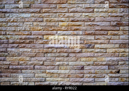 Old brown stone bricks wall pattern background of brick wall Stock Photo