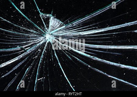 broken glass on a black background cracked. texture Stock Photo