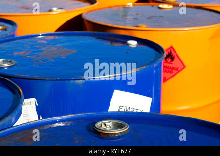Top of 200 litre 55 US gallon empty gasoline drums in storage area awaiting pick up Stock Photo