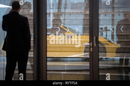 Stuttgart, Germany. 15th Mar, 2019. A Porsche 911 Carrera 4S Cabrio is reflected in a disc before Porsche AG's annual press conference. Last year, Porsche was able to sell significantly more of its top models and thus again generate more profit despite rising expenditure. Credit: Marijan Murat/dpa/Ģ����ý Live News Stock Photo