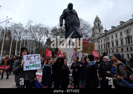 London, United Kinngdom - Friday 15 March 2019: Thousands of students and supporters gathered to picket on Parliament Square and The Departmnent for Business Energy and Industrial Strategy in support of Youth Strike 4 Climate. The #fridaysforfuture movement was started by Greta Thunberg, a 16 year-old Swedish Climate Activist and has gained momentum around the world. Stock Photo