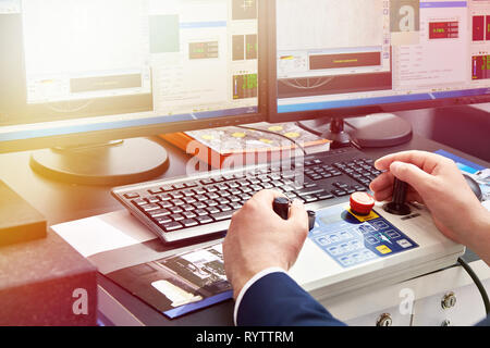 Operator works on a Coordinate Measuring Machine Stock Photo