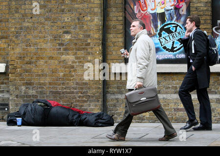 A homeless person sleeping rough outside The London Dungeon. 30.03.2010. Stock Photo