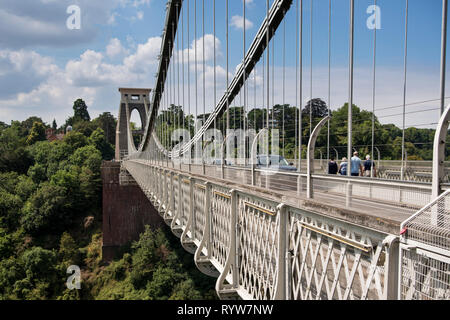 Pedestrians and cars on the Clifton Suspension Bridge spanning Avon Gorge and River Avon, Bristol, UK Stock Photo