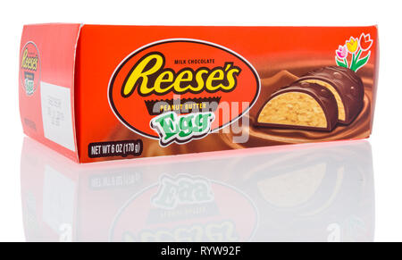 Winneconne, WI - 10 March 2019: A package of Reeses peanut butter egg on an isolated background Stock Photo