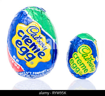 Winneconne, WI - 10 March 2019: A package of  mini Cadbury creme egg and regular Cadury creme egg on an isolated background Stock Photo