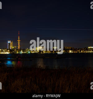 Night view of Hamburg's cityscape across the Alster river Stock Photo