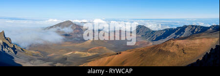 Haleakala Crater - A panoramic view of the crater at summit (10,023 feet) of Haleakala, also called East Maui Volcano, surrounded by sea of clouds. Ma Stock Photo