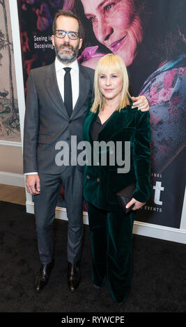 Eric White and Patricia Arquette wearing suit by Bella Freud