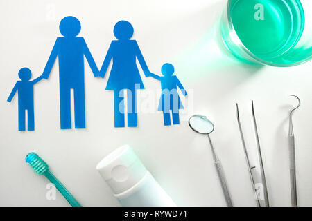 Professional family concept dentist with tools on white table. Horizontal composition. Top view Stock Photo