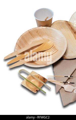 Bamboo disposable tableware and plates and cutlery for picnic on the white background. Stock Photo
