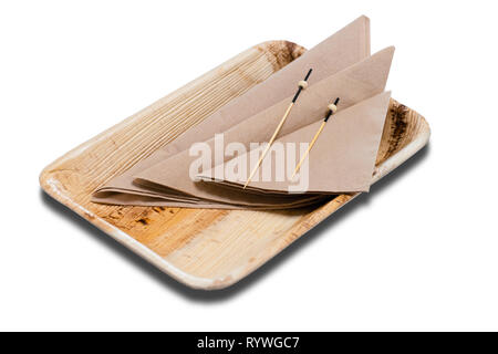 Wooden disposable container with napkins on the white background. Stock Photo