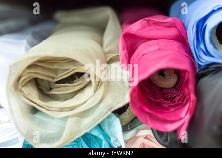 Detail of multicolored fabric rolls for sale in a fabric store. Saara, Rio de Janeiro, Brazil. 2019 Stock Photo