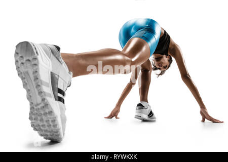 Young african woman preparing to start run isolated on white studio background. One female runner or jogger. Silhouette of jogging athlete. Stock Photo