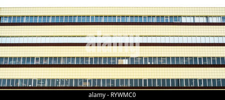 The facade of an industrial building. Details of the facade of aluminum panels with Windows on the industrial building Stock Photo