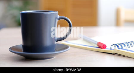 Open the diary a planner, a pencil and glasses on the table closeup Stock Photo
