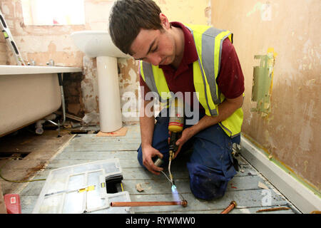 Apprentice joiner working towards NVQ level 3 gas whilst on Nottingham City Homes, One In A Million Scheme. Nottingham. 17.3.10 Stock Photo